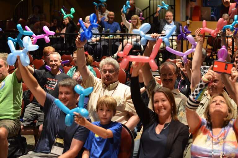 People holding balloon animals