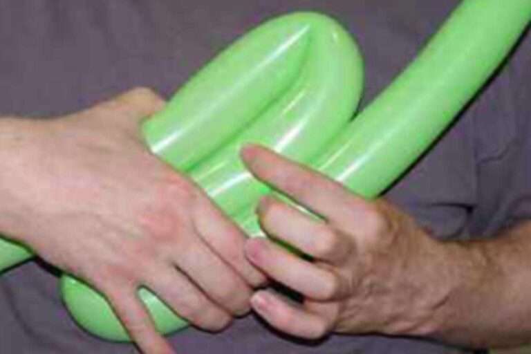 Making a balloon sculpture.